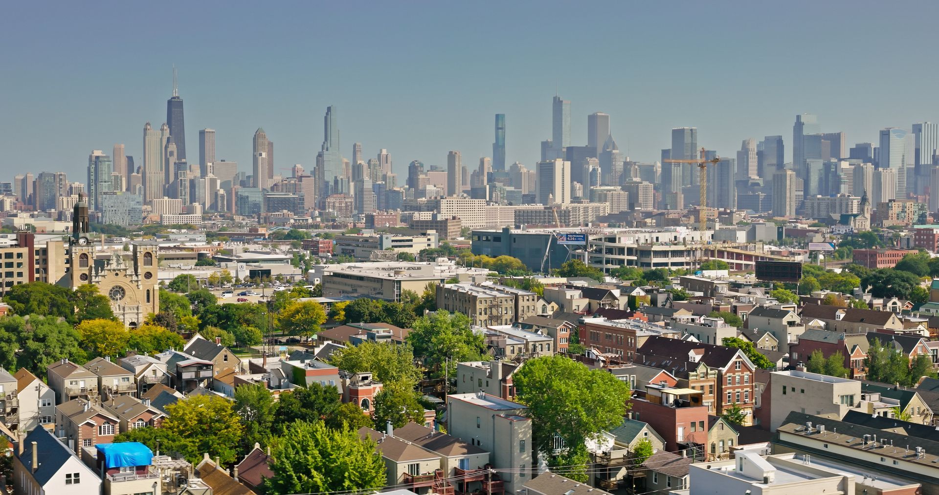 An aerial view of a city with a skyline in the background.