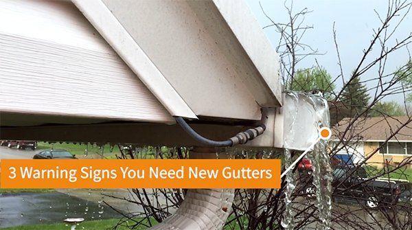 There are warning signs you need new gutters on the side of a house.