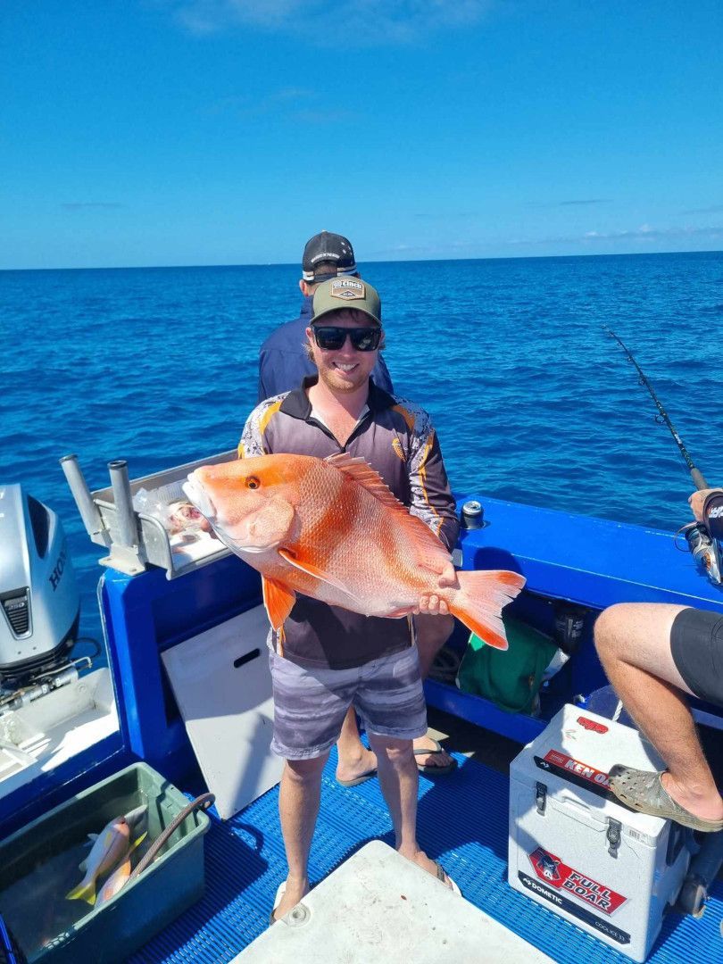A Boy and Two Girls Are Holding Fish on a Boat — Whitsunday Fishing Charters In Airlie Beach, QLD