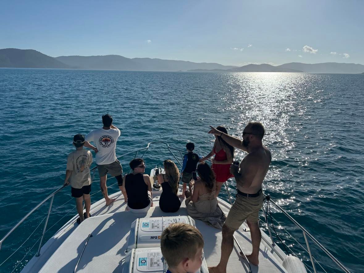 People On A Boat Deck Enjoying A Sunny Day On The Water — Whitsunday Fishing Charters In Airlie Beach, QLD