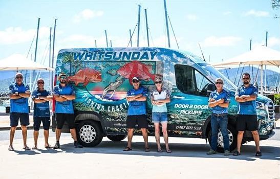 Three Men Are Posing for a Picture on a Deck — Whitsunday Fishing Charters In Airlie Beach, QLD