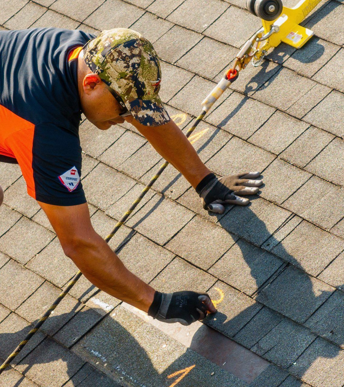 A roof with a lot of shingles missing and a hole in it