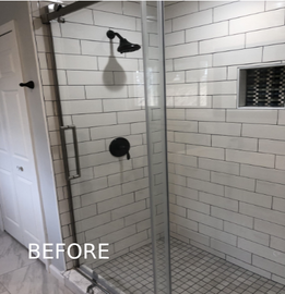 A before picture of a shower with white tiles