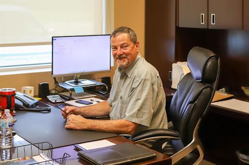 Bryan Biechler of KDAR Company sitting at his desk