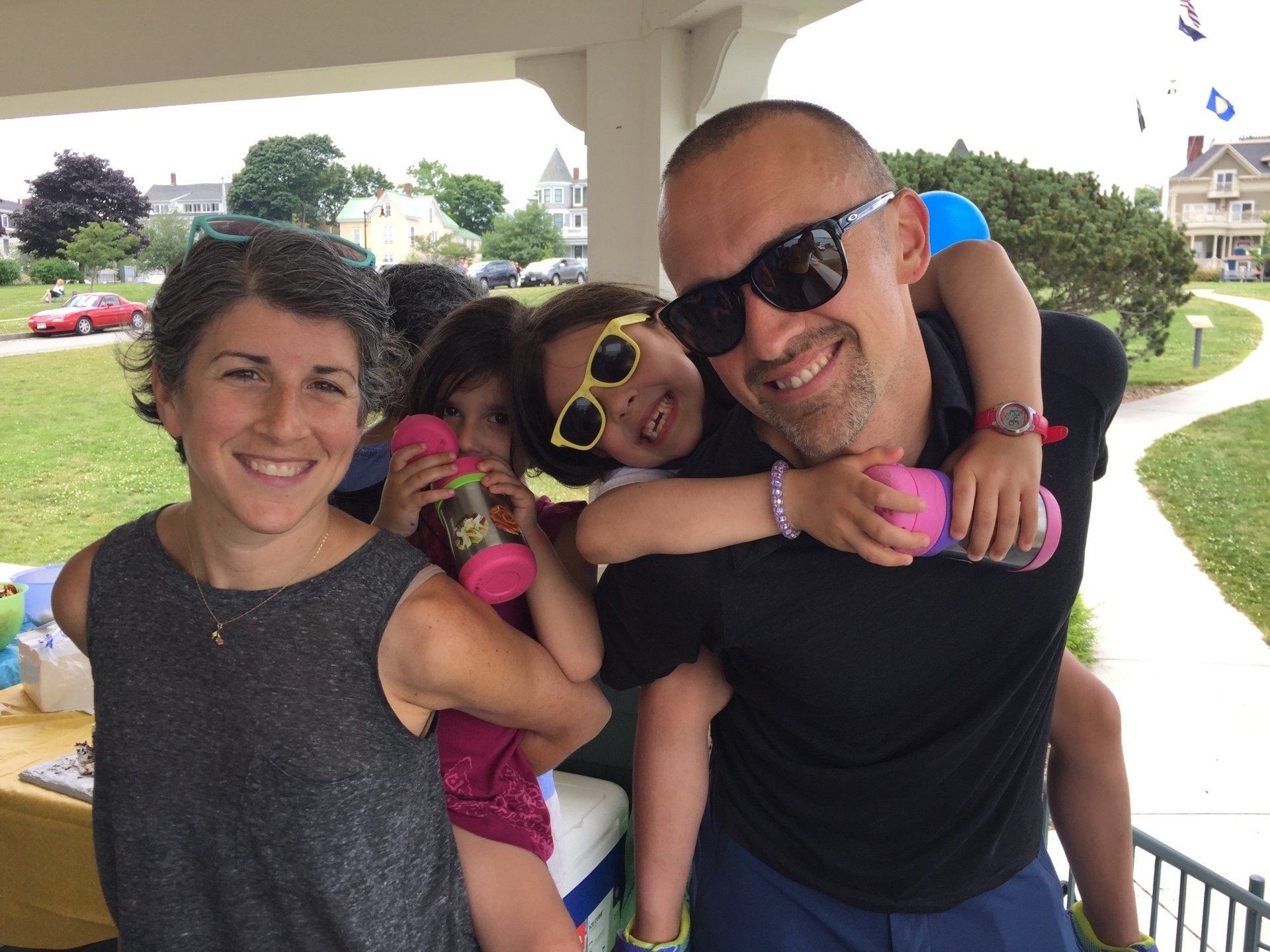 Photo of smiling family, parents and kids