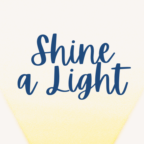 Blue text reads Shine a Light with a yellow spotlight background