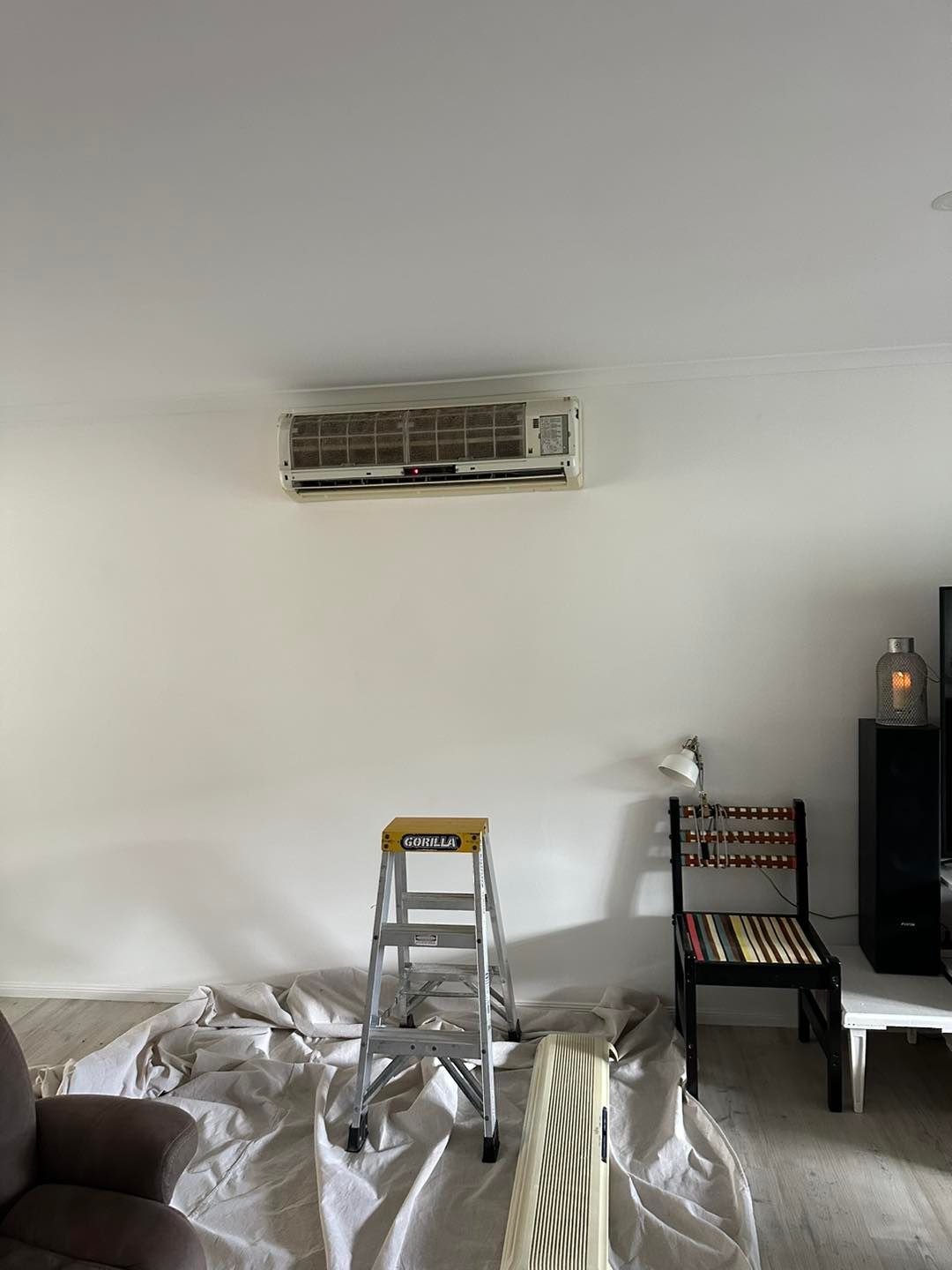 Air Conditioner on White Wall — DJL Refrigeration & Air Conditioning In Cannonvale, QLD