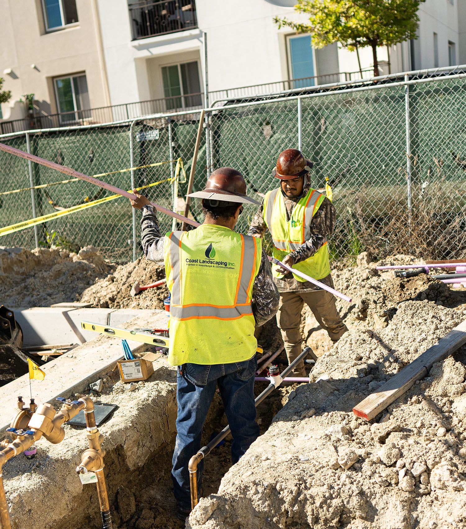 A group of construction workers are working on a construction site.