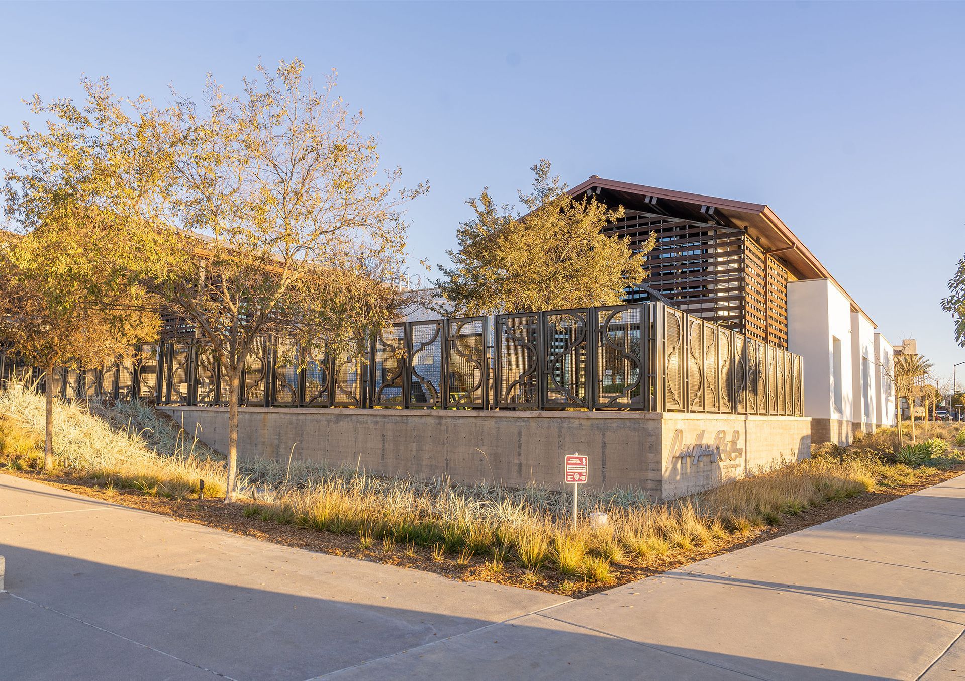 A bicycle is parked on a bed in a hotel room.