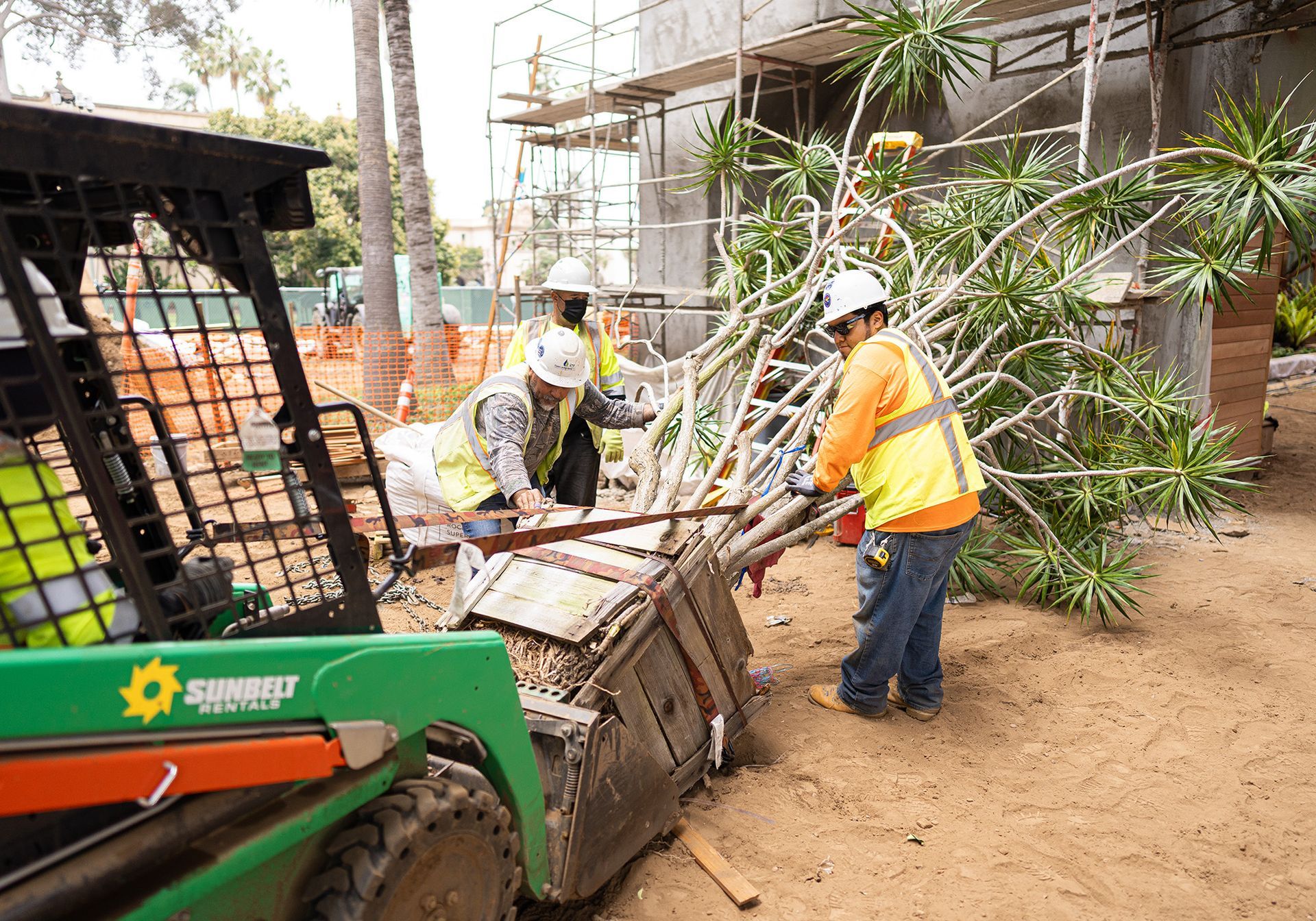 A group of construction workers are working on a construction site.