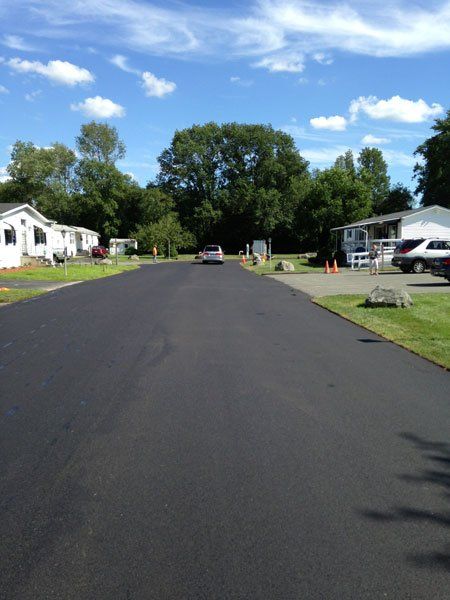 New asphalt road  - Driveway Contractors & Construction in Middleboro, MA