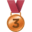 A bronze medal with a red ribbon and the number three on it.