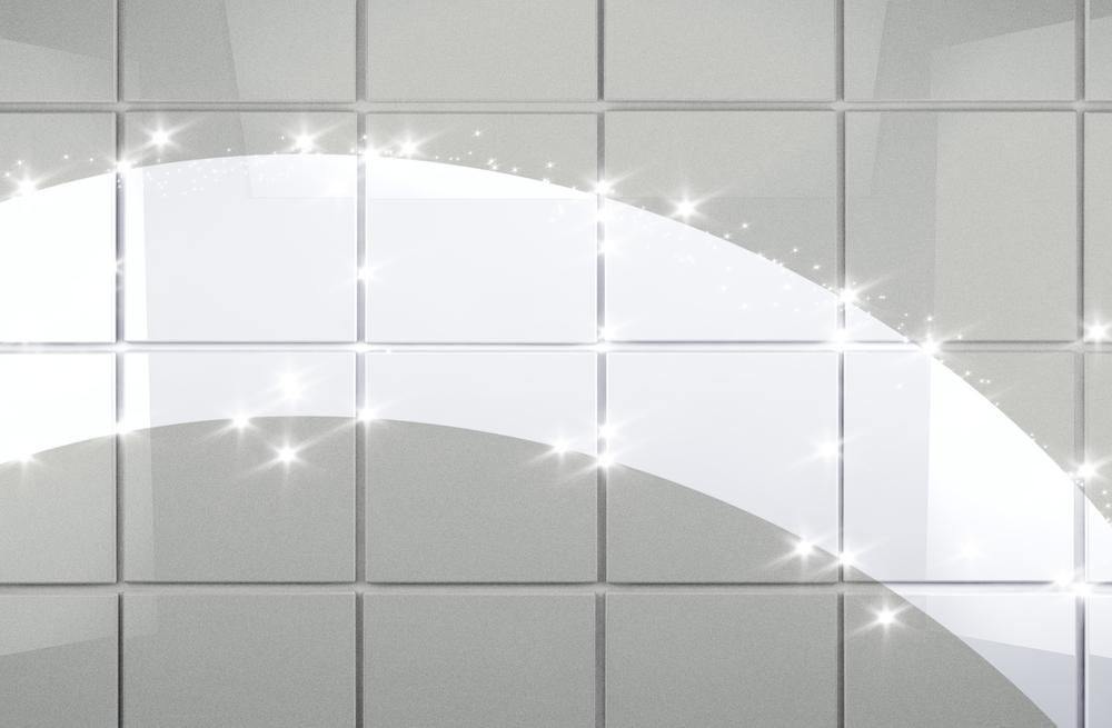 A Close Up of a Shiny Tile Wall With Sparkles Coming Out of It — Rugrats Carpet Cleaning Service In Charlotte Bay, NSW