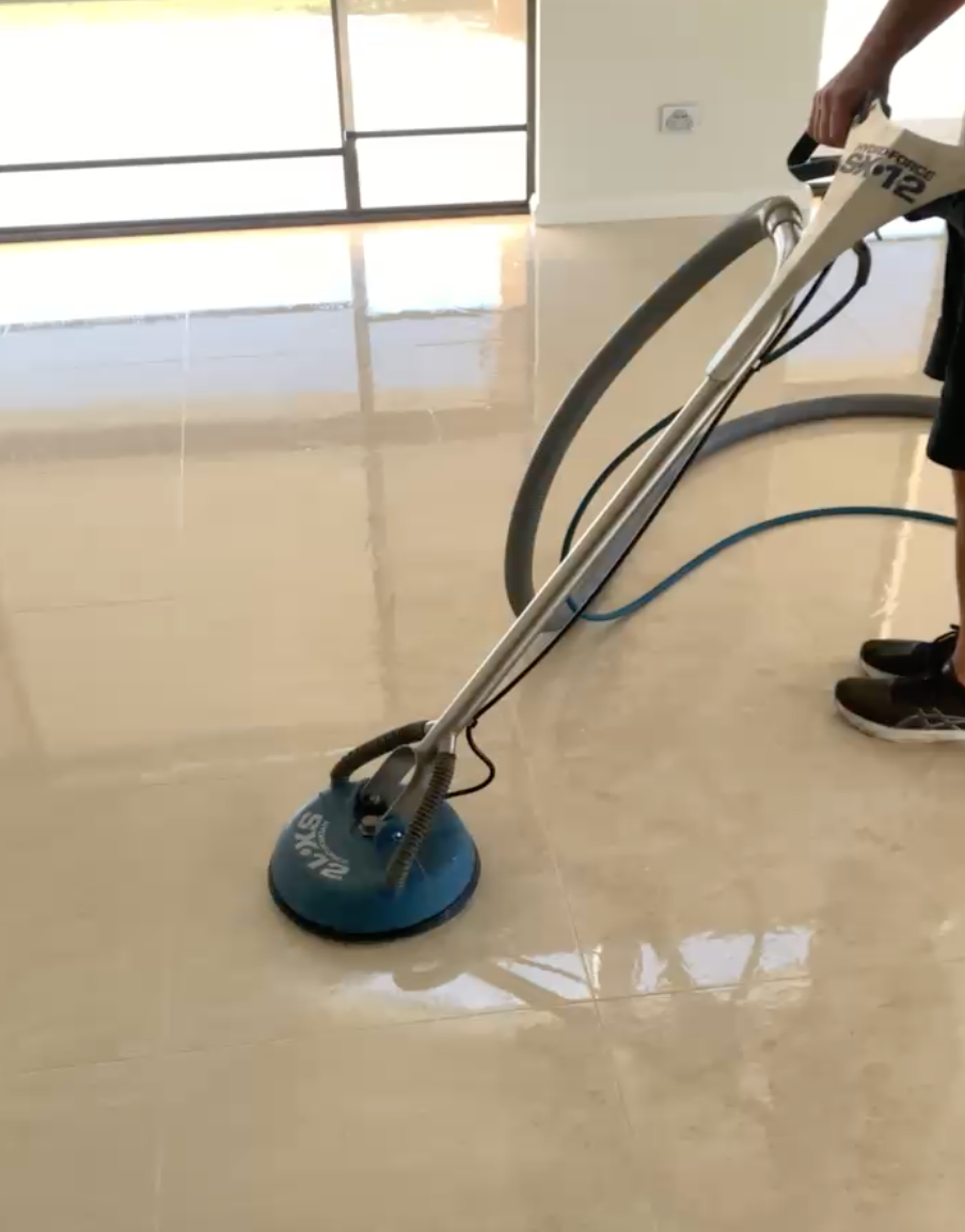 Person Wearing Yellow Gloves Uses a Utility Knife to Cut or Scrape Grout — Rugrats Carpet Cleaning Service In Tuncurry, NSW