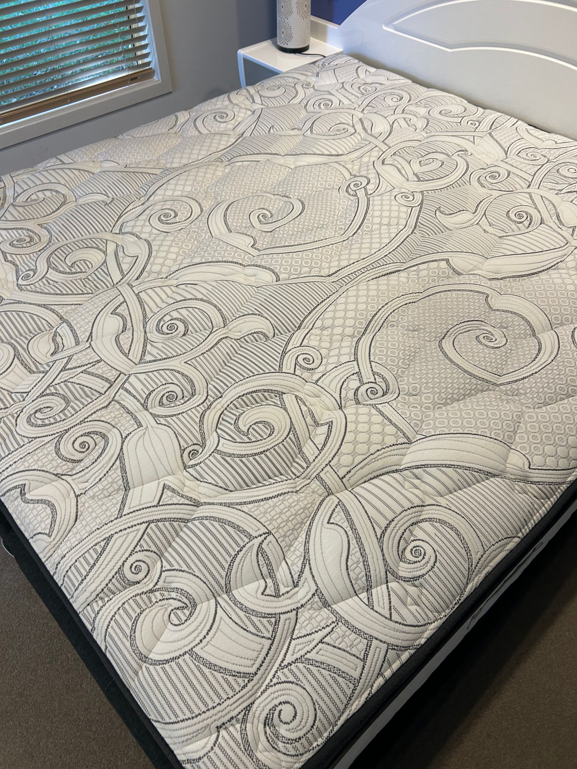 A Person is Using a Vacuum Cleaner to Clean a Bed — Rugrats Carpet Cleaning Service In Tuncurry, NSW