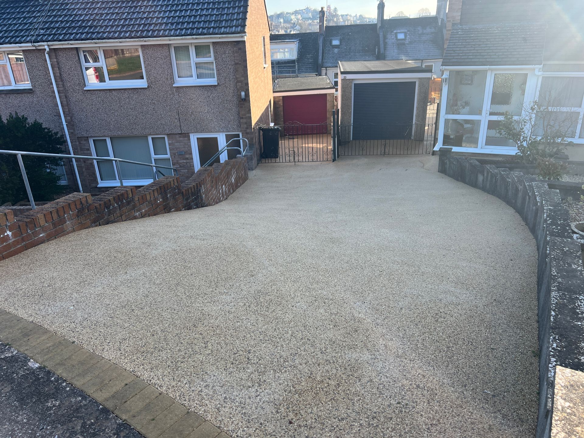 Gold resin driveway shared by 2 separate houses.