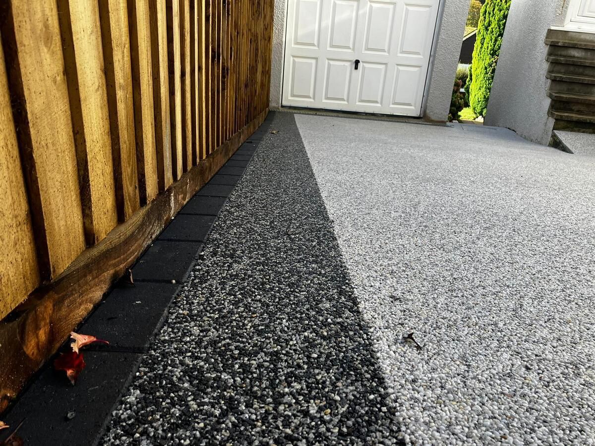Two-tone resin pathway with a charcoal black border.
