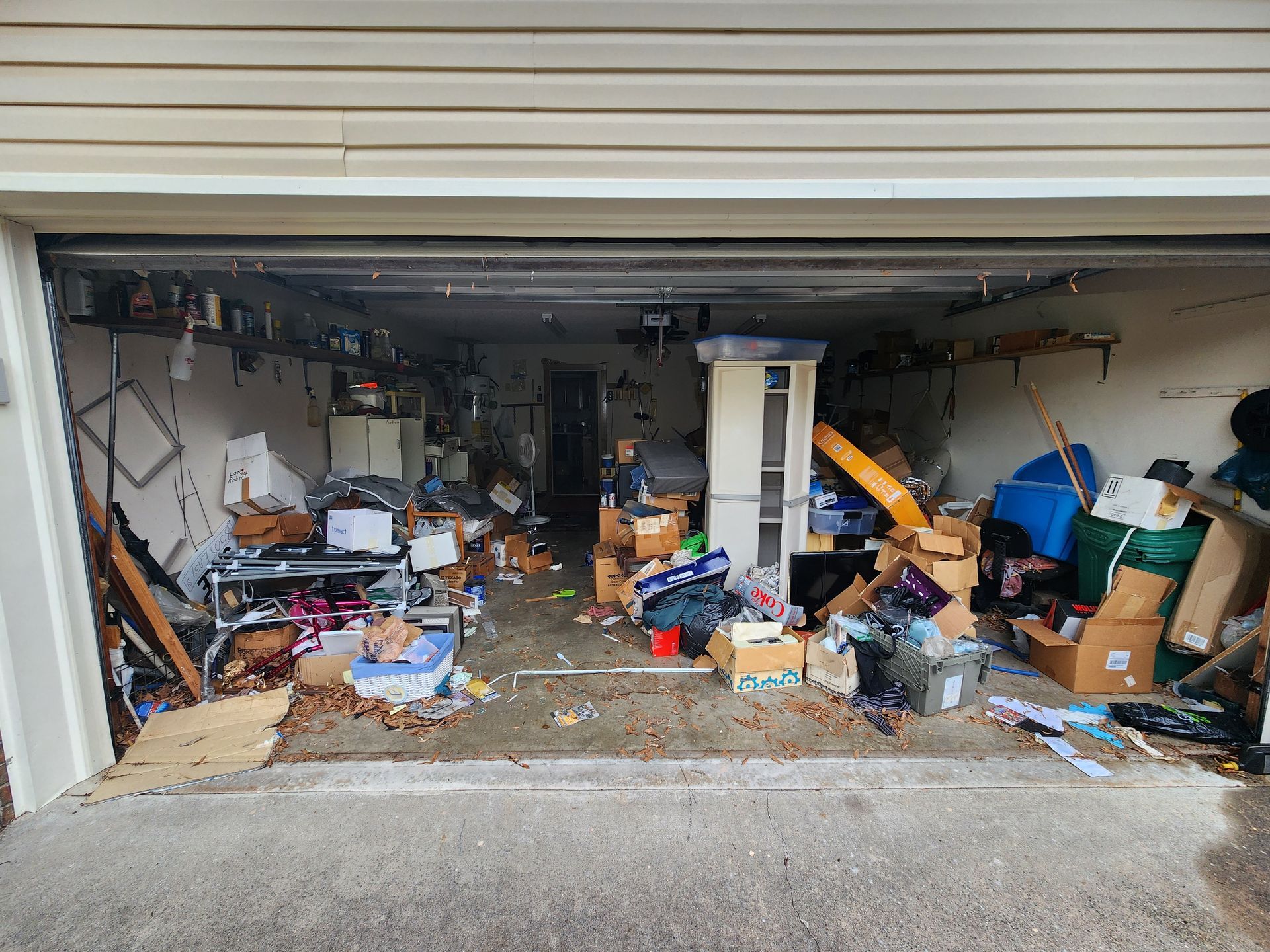 A dining room with a table and chairs in front of a large window.