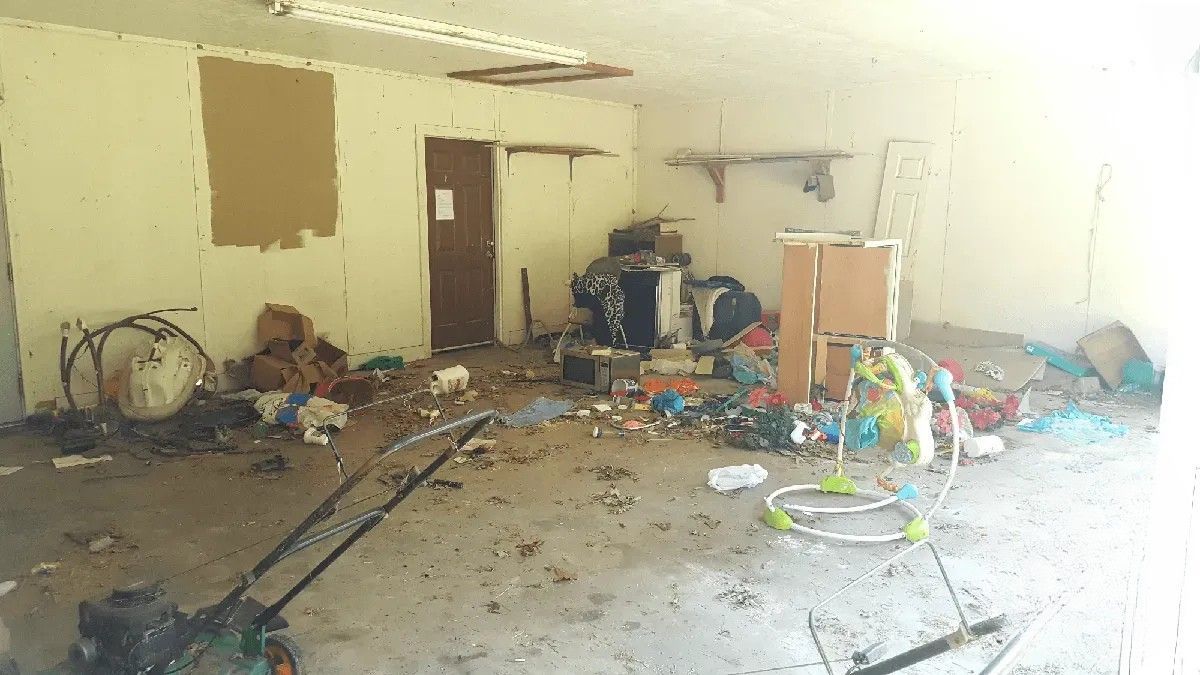 A room filled with lots of trash and toys.