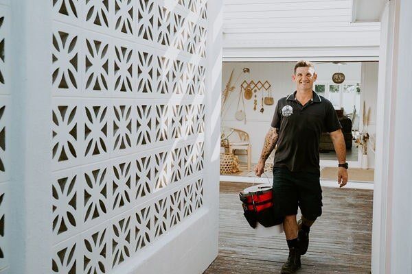 Plumber fixing a kitchen pipe —Emergency plumber in Tugun, QLD