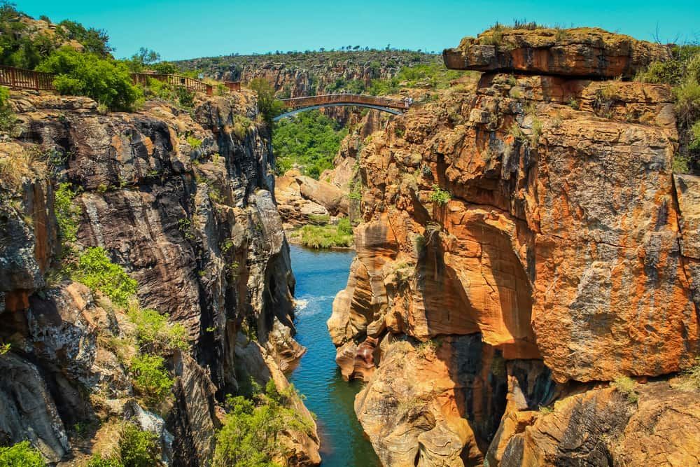 A River Runs Through A Narrow Canyon Between Two Rocky Cliffs — Ag Auto Spark in Bourke, NSW