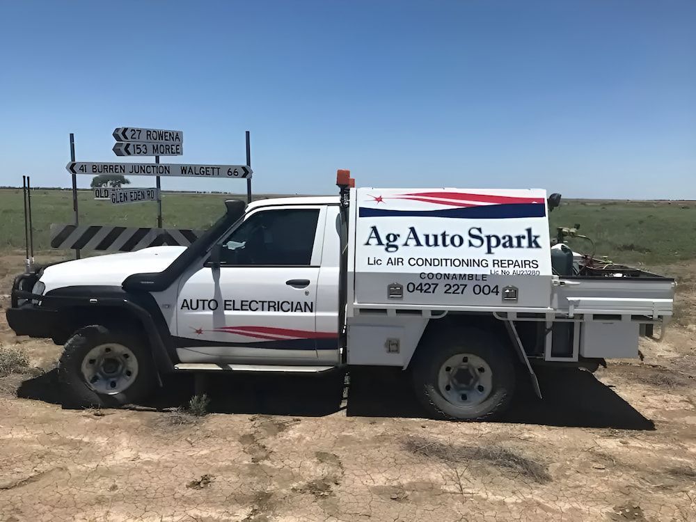 A White Truck Is Parked In The Middle Of A Dirt Field — Ag Auto Spark in Narromine, NSW