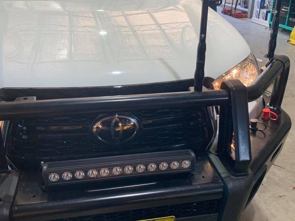 A White Ute Has Its Lights On— Ag Auto Spark in Walgett, NSW