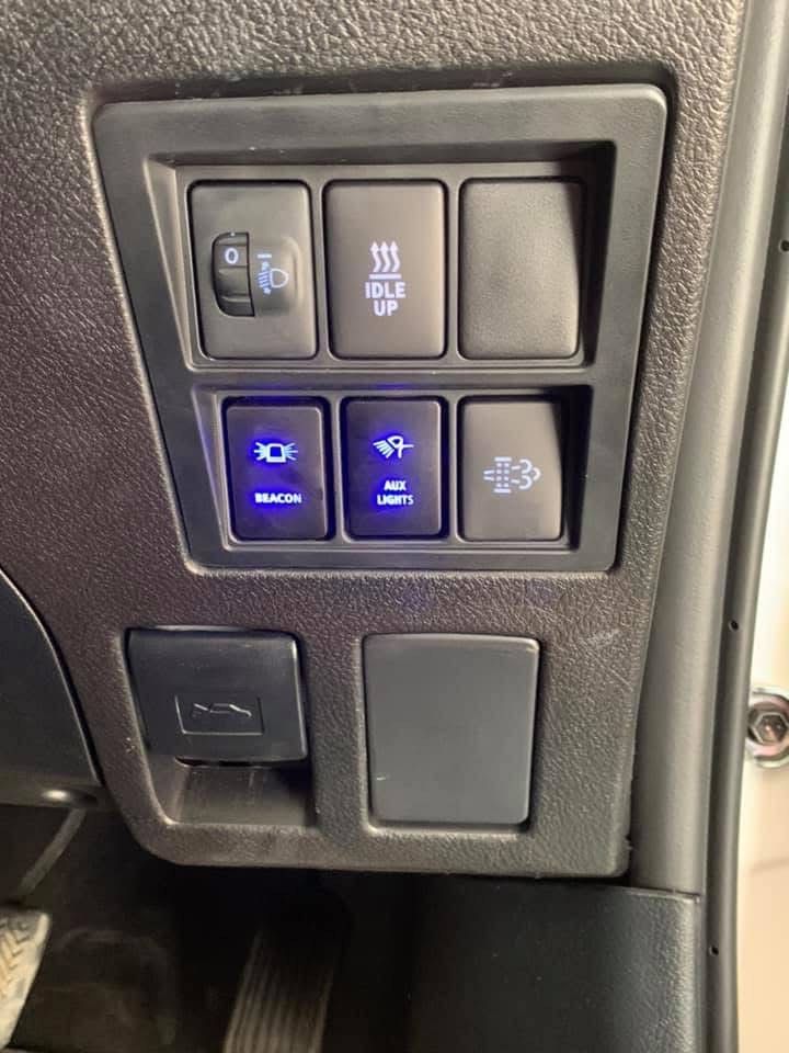 A Man Is Charging A Car Battery With A Jump Starter — Ag Auto Spark in Warren, NSW