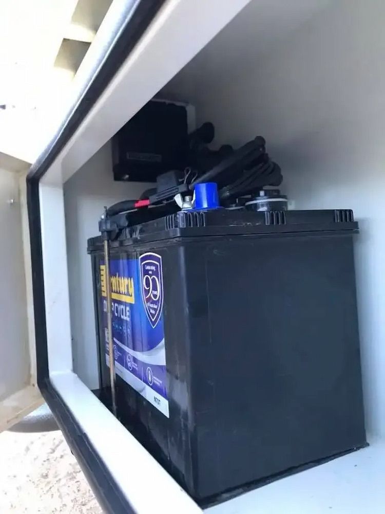 A Black Battery Is Sitting Inside Of A White Box — Ag Auto Spark in Narromine, NSW