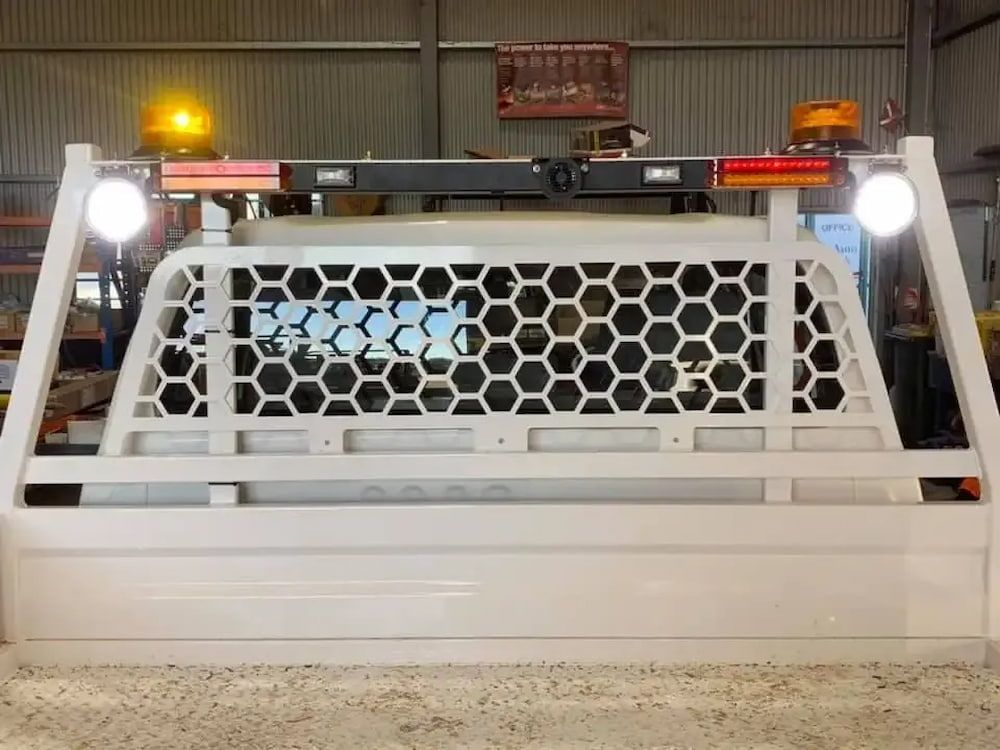 A White Truck Bed With A Honeycomb Design And Lights On Top Of It — Ag Auto Spark in Narromine, NSW