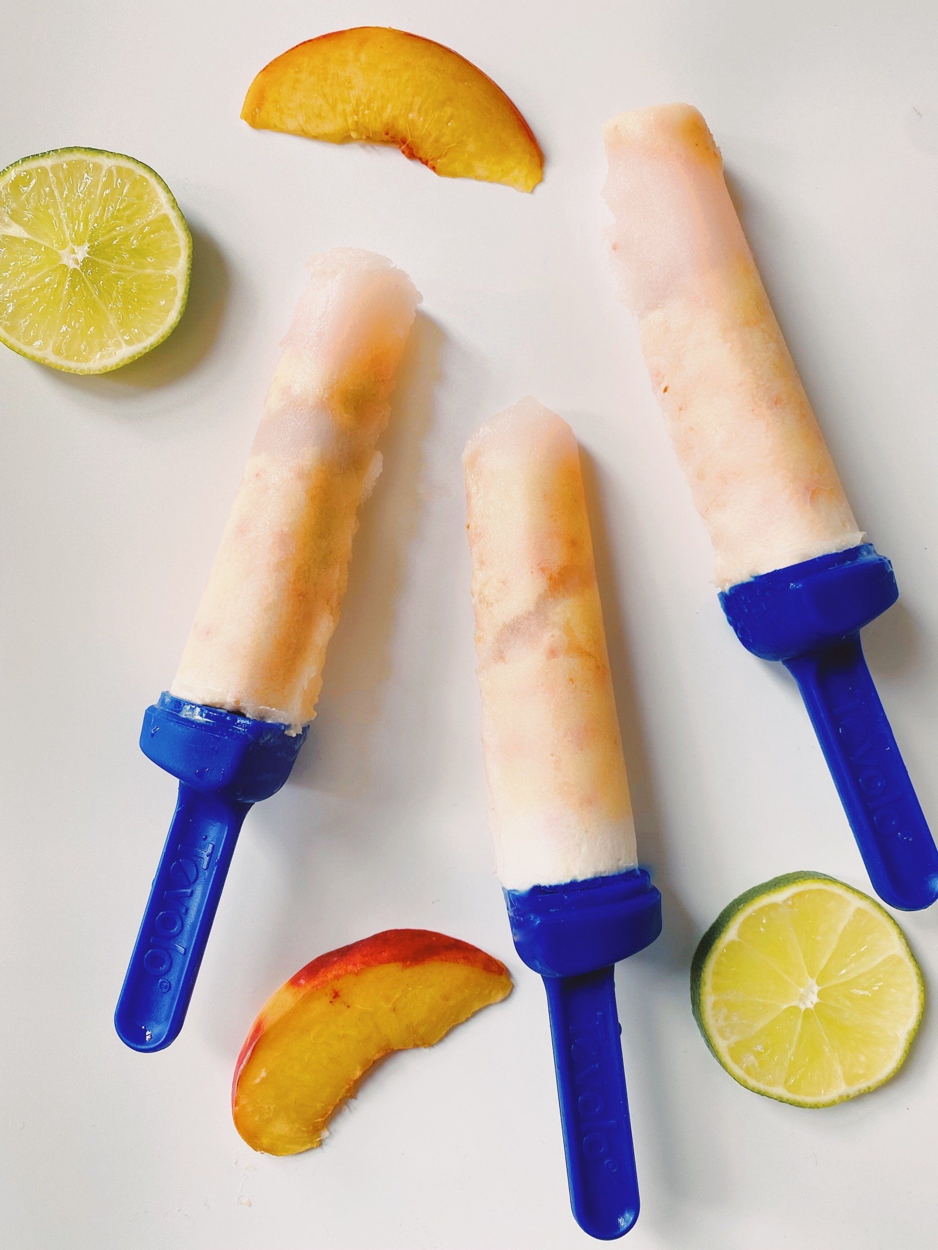 Peach popsicles with blue handles