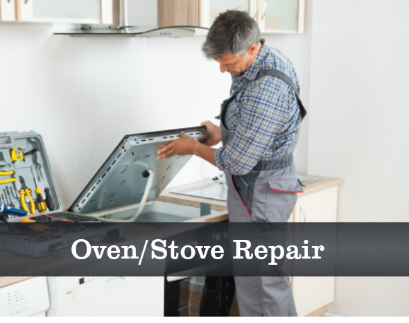 A man is repairing an oven and stove in a kitchen.
