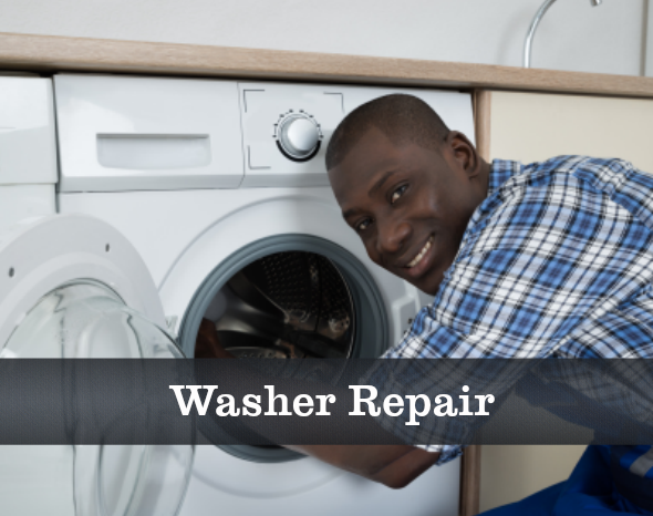 A man in a plaid shirt is working on a washer