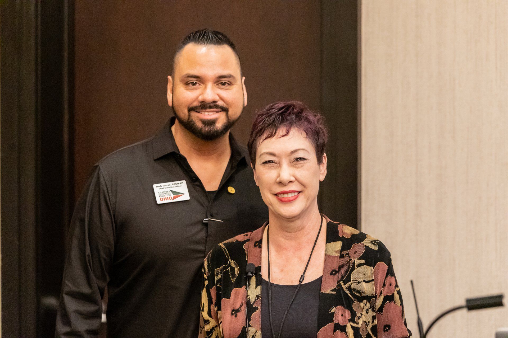 A man and a woman are posing for a picture together.