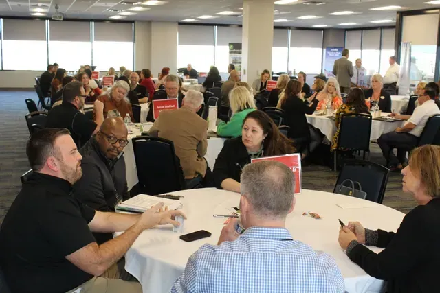 A gold medal that says workforce solutions on it