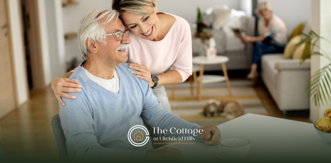 A woman talking to her senior father about touring a senior living facility
