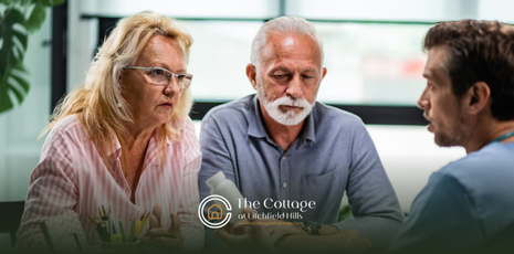 A geriatric care manager talking to an elderly couple
