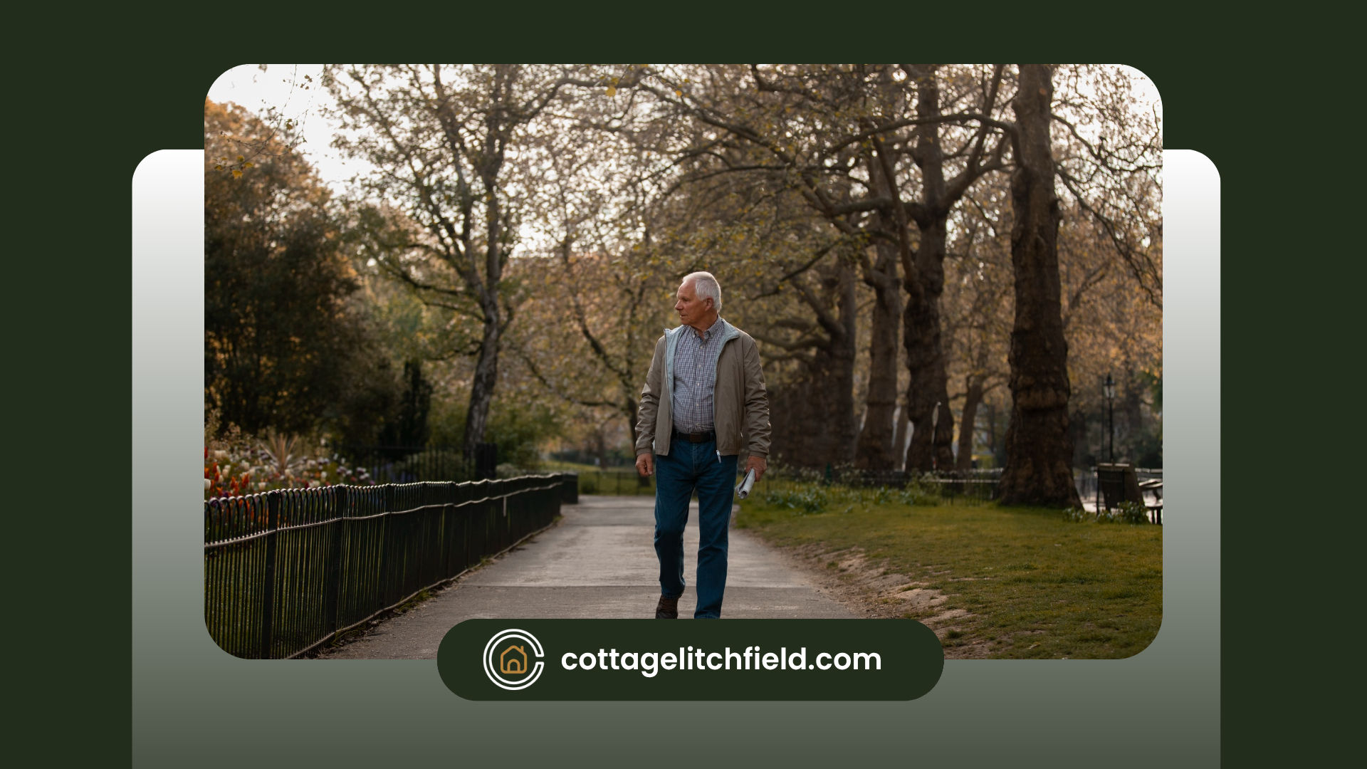 An older man is walking down a path in a park.