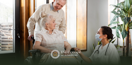 An assisted living resident with her husband talking to a nurse