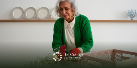 An elderly woman volunteering in senior living