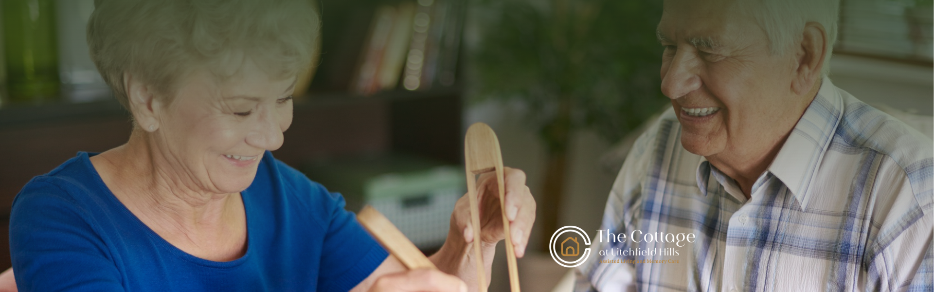 An elderly couple eating together