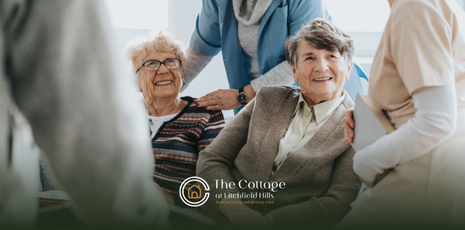 Two smiling respite care residents with caregivers.