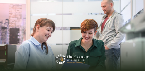 A group of assisted living staff talking together in a room