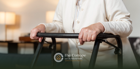 A senior walking with the help of a mobility aid