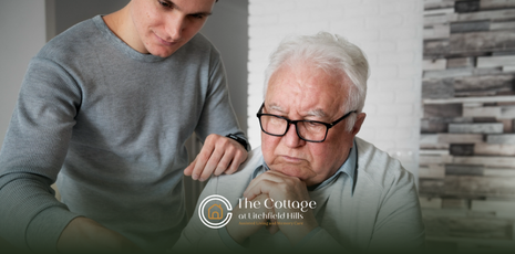 A caregiver talking to a senior with memory loss