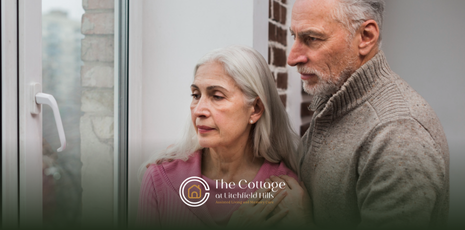 Two elderly couple looking through a window