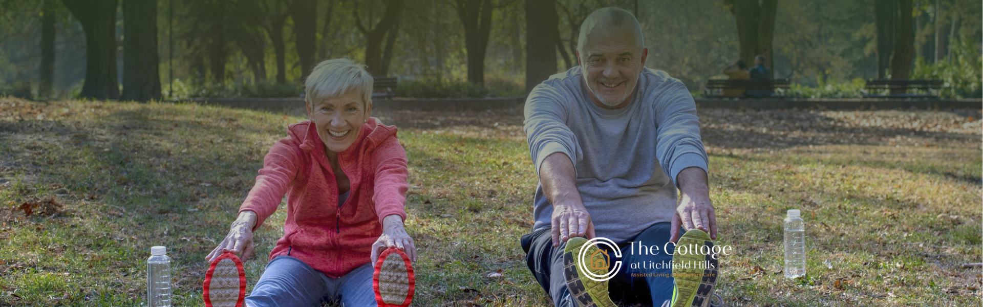 Two elderly people exercising outdoors