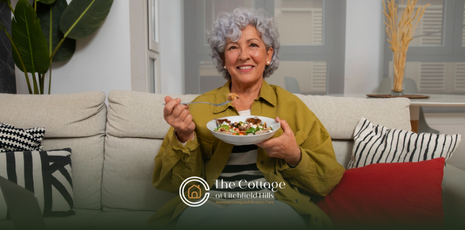 An elderly woman eating a healthy bowl of food