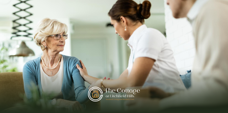 A respite care staff member is assisting a resident
