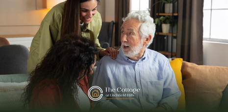 An elderly man talking to his children